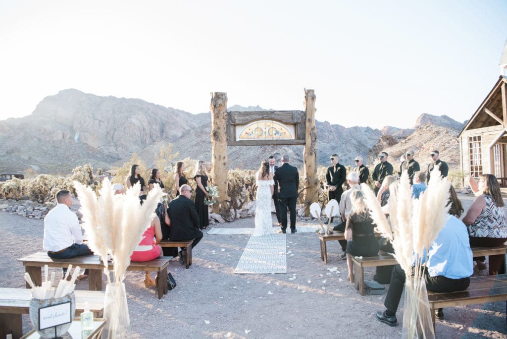 Couple at end of aisle at the alter