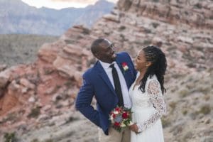 Couple smiles at each other.