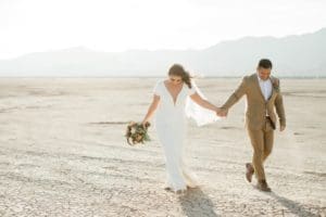 Kerrigan and Trevor walking, holding hands.